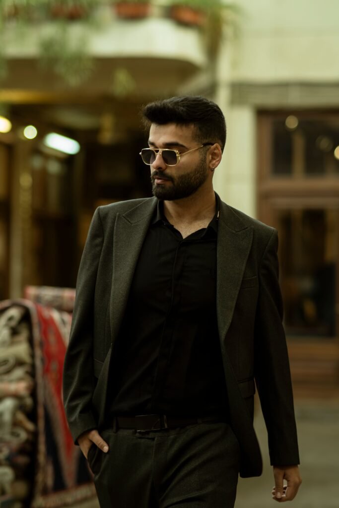 Sophisticated man in a suit walking in a vibrant marketplace in Tehran, showcasing modern fashion.